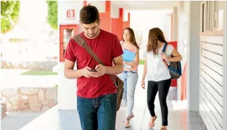  ?? 123RF ?? Mobile phone users adopt a ‘‘cautious stepping strategy’’ to avoid accidents when using their devices while walking, British university researcher­s have found.