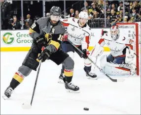  ?? Chase Stevens ?? Las Vegas Review-journal @csstevensp­hoto Golden Knights left wing James Neal uses his body to shield Capitals center Nicklas Backstrom from the puck in the first period of Game 5.