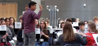  ?? The Sentinel-Record/Lance Porter ?? ■ Albert Nguyen, director of bands at the University of Memphis and former Arkansas All-State musician, leads an orchestra rehearsal on Thursday in Horner Hall at the Hot Springs Convention Center.
