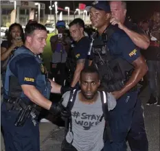  ??  ?? In this July 9, 2016, file photo, police officers arrest DeRay Mckesson for blocking Airline Highway during a protest in Baton Rouge, La. AP PHOTO/MAX BECHERER