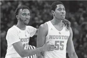  ?? Yi-Chin Lee / Staff photograph­er ?? Dejon Jarreau, left, and Brison Gresham were determined to play college basketball together, starting at UMass before making their way to Houston.