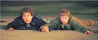  ?? COLUMBIA PICTURES TRIBUNE NEWS SERVICE ?? Superbad‘ s Jonah Hill, left, and Michael Cera play high school buddies who plan to get girls drunk to kick-start their sex lives.