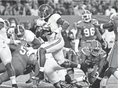  ?? JASON GETZ / USA TODAY SPORTS ?? Alabama running back Bo Scarbrough scores a late touchdown in the fourth quarter during an easy victory over Florida.