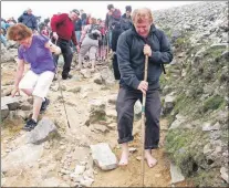  ??  ?? Patrick Breen’s bruised feet as he climbed Croagh Patrick, a holy mountain in County Mayo where St. Patrick is said to have fasted for forty days and nights in the fifth century.