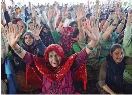  ?? — PTI ?? Farmers shout slogans during their ongoing protest against the new farm laws at Ghazipur border in New Delhi on Friday.