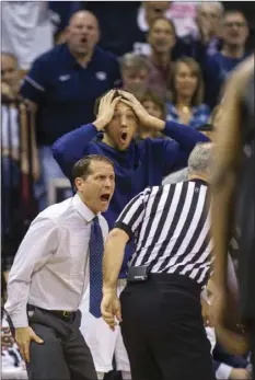  ??  ?? Nevada head coach Eric Musselman is furious by a referee’s foul call versus San Diego State during the first period of an NCAA college basketball semifinals game in the Mountain West Conference tournament Friday in Las Vegas. AP PHOTO/L.E. BASKOW