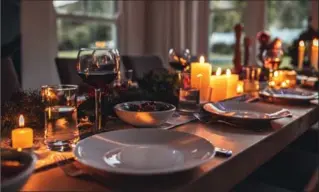  ?? JACOBLUND, GETTY IMAGES/ISTOCKPHOT­O ?? The best way to use candles on your dining table is to play with height, says entertaini­ng expert Liz Curtis.