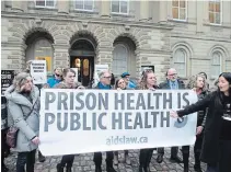  ?? CHRIS YOUNG THE CANADIAN PRESS ?? Protesters gather outside court ahead of a constituti­onal challenge to the federal ban on syringes in prisons.