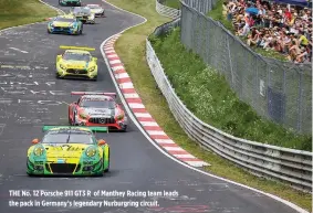  ??  ?? THE No. 12 Porsche 911 GT3 R of Manthey Racing team leads the pack in Germany’s legendary Nurburgrin­g circuit.