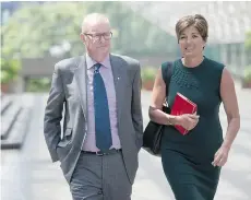  ?? JONATHAN HAYWARD/THE CANADIAN PRESS ?? Former Vancouver Olympics CEO John Furlong and former Games spokeswoma­n Renee Smith-Valade leave B.C. Supreme Court June 15. Furlong is being sued by journalist Laura Robinson for defamation.