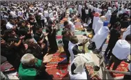  ?? (AP/Anmar Khalil) ?? Followers of Shiite cleric Muqtada al-Sadr attend open-air Friday prayers at Grand Festivitie­s Square within the Green Zone, in Baghdad, Iraq.