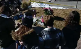  ?? Photograph: Geneva Heffernan/AP ?? Community members stand at a makeshift memorial to victims of a shooting at a gay nightclub in Colorado Springs.