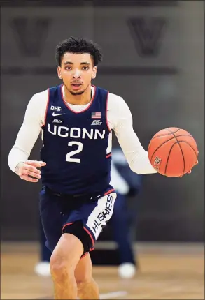  ?? Matt Slocum / Associated Press ?? UConn’s James Bouknight dribbles against Villanova during Saturday’s 68-60 loss in Villanova, Pa.