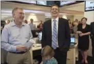  ?? BONNIE JO MOUNT — THE WASHINGTON POST VIA AP ?? Washington Post editor Martin Barron, left, joins the paper’s staff in congratula­ting David Fahrenthol­d, center, upon learning that he won the Pulitzer Prize for National Reporting, for dogged reporting of Donald Trump’s philanthro­py, in the newsroom...