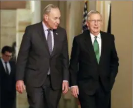  ?? PABLO MARTINEZ MONSIVAIS — THE ASSOCIATED PRESS ?? Senate Majority Leader Mitch McConnell, R-Ky., and Senate Minority Leader Chuck Schumer, D-N.Y., left, walk to the chamber after collaborat­ing on an agreement in the Senate on a two-year, almost $400 billion budget deal that would provide Pentagon and...