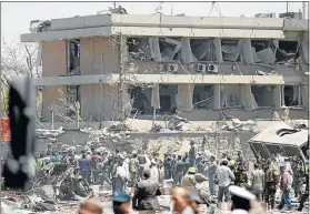  ??  ?? GUTTED: Afghan officials inspect outside the German embassy after a blast in Kabul