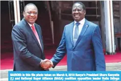  ??  ?? NAIROBI: In this file photo taken on March 9, 2018 Kenya’s President Uhuru Kenyatta (L) and National Super Alliance (NASA) coalition opposition leader Raila Odinga shake hands after addressing a press conference at Harambee house office. —AFP