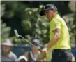  ?? CHARLIE RIEDEL — THE ASSOCIATED PRESS ?? Rickie Fowler watches a putt on the fifth hole during the first round of the PGA Championsh­ip golf tournament at Bellerive Country Club, Thursday in St. Louis.