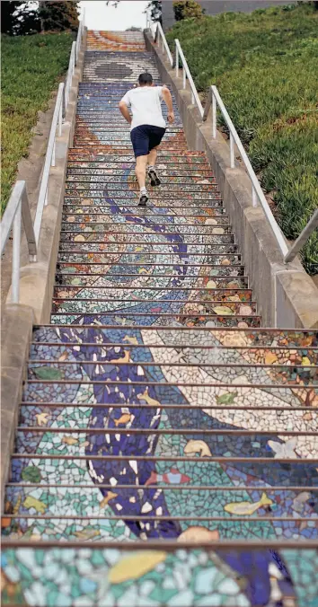  ?? Siana Hristova / The Chronicle ?? The 163 steps on the 16th Avenue staircase, seen from the bottom up, are a work of art. The view from the top is a masterpiec­e of nature.
