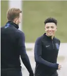  ??  ?? Harry Kane with Jadon Sancho in training.