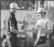  ?? Associated Press ?? Ludvig Åberg, of Sweden, (left) shakes hands with his caddie after his putt on the 18th green during the final round of the RSM Classic golf tournament, Nov. 19, in St. Simons Island, Ga.