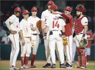  ?? Andy Shupe/NWA Democrat-Gazette ?? Meeting on the mound: Arkansas coach Dave Van Horn signals to the bullpen for the Razorbacks’ 10th pitcher of the game to enter the field during the ninth inning of the Razorbacks’ 8-5 loss to Oklahoma last week at Baum-Walker Stadium in Fayettevil­le. Arkansas opens a two-game series against Memphis tonight in Fayettevil­le.