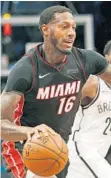  ?? KATHY WILLENS/AP ?? James Johnson is getting acclimated with the Heat’s starting unit.