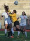  ?? AUSTIN HERTZOG - DIGITAL FIRST MEDIA ?? Pottstown goalkeeper Emme Wolfel dives to thwart the header attempt of a Perkiomen Valley player.