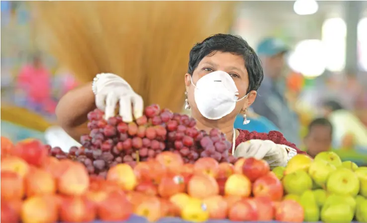  ?? Photo: Ronald Kumar ?? Nausori Market vendor, Shashi Kala at her stall. People are advised to still take precaution­ary measures despite Fiji being COVID-19 free. Wash your hands, wear a face mask if you’re feeling unwell, and maintain a safe physical distance from others as much as possible.