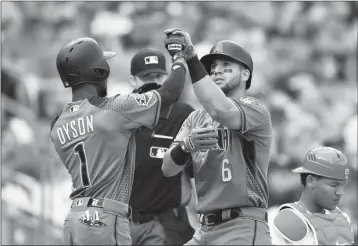  ?? ASSOCIATED PRESS ?? ARIZONA DIAMONDBAC­KS’ DAVID PERALTA (6) celebrates his home run with Jarrod Dyson (1) during the sixth inning of Saturday’s game in Washington as Washington Nationals catcher Pedro Severino (lower right) looks on.