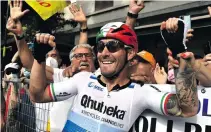  ??  ?? Italian rider Giacomo Nizzolo of Team Qhubeka Assos celebrates after winning the 13th stage of the 2021 Giro d’Italia on 21 May.