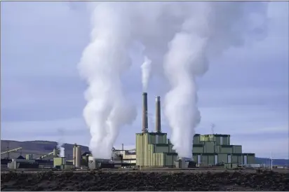  ?? RICK BOWMER — THE ASSOCIATED PRESS FILE ?? Steam billows from a coal-fired power plant in Craig, Colo.