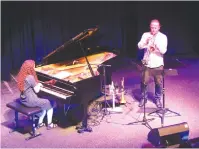  ?? (Barry Davis) ?? SYLVIE COURVOISER plays piano while Lorenz Raab accompanie­s on trumpet.