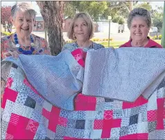  ??  ?? QUILT RAFFLE: From left, Merrilyne Middleton, Von Harding and Pam Byron with a quilt Stawell Mother’s Day Classic organisers are raffling.