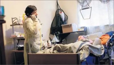  ?? Photos by Rick M. Scibelli Jr. for USA TODAY ?? Help is nearby: Physician Elizabeth Ward checks on patient Frank Blondin at his home, what Ward calls a patient’s “base of power.”