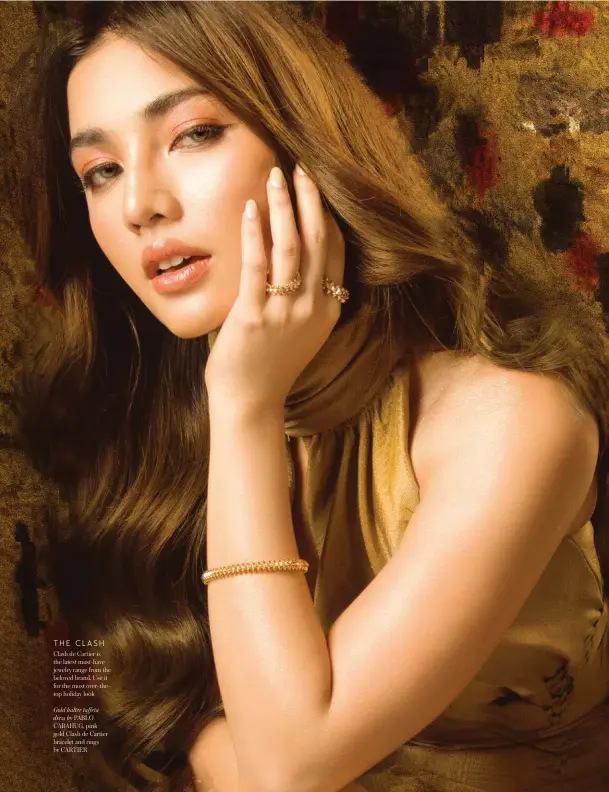  ??  ?? THE CLASH Clash de Cartier is the latest must-have jewelry range from the beloved brand. Use it for the most over-thetop holiday look
Gold halter taffeta dress by PABLO CABAHUG, pink gold Clash de Cartier bracelet and rings by CARTIER