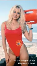  ??  ?? At the height of her
Baywatch fame