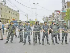  ?? AMAL KS/HT PHOTO ?? Security personnel deployed in the Jahangirpu­ri area on Thursday. Police have cordoned off the C-block locality after violent clashes on Saturday.