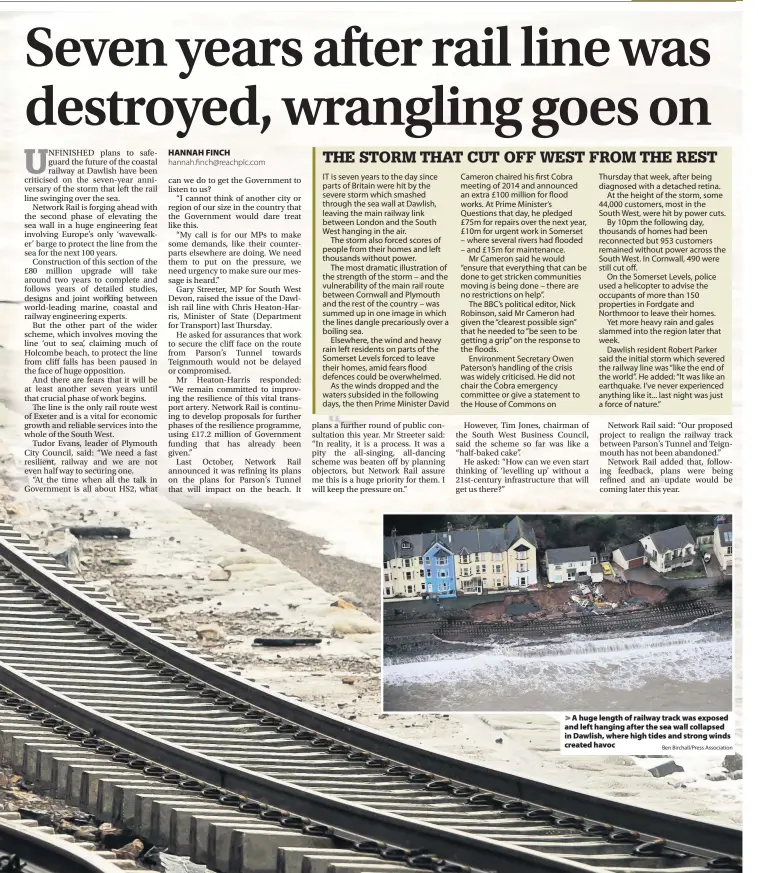  ?? Ben Birchall/Press Associatio­n ?? A huge length of railway track was exposed and left hanging after the sea wall collapsed in Dawlish, where high tides and strong winds created havoc