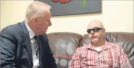  ?? Picture: Kim Cessford. ?? Health secretary Alex Neil visited Keith Swankie, from Arbroath, who suffers from PSP.