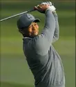  ?? Michael Reaves/Getty Images ?? Tiger Woods shot a 1-under 70 the first round of the Valspar Championsh­ip on Thursday in Palm Harbor, Fla.