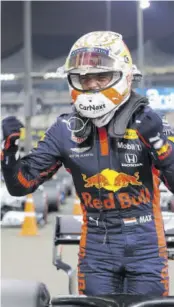  ?? (Photos: AFP) ?? Red Bull’s Dutch driver Max Verstappen celebrates taking pole position after the qualifying session on the eve of the Abu Dhabi Formula One Grand Prix at Yas Marina Circuit in the Emirati city of Abu Dhabi, yesterday.