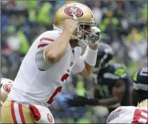  ?? AP PHOTO/ELAINE THOMPSON ?? San Francisco 49ers quarterbac­k Brian Hoyer yells on the line of scrimmage in the second half of an NFL football game against the Seattle Seahawks, Sunday, in Seattle.