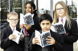  ?? Picture: Steve Bould ?? HEAD IN A BOOK: Pupils Elliot Groves, Cynthia Lemba Lemba, Zayan Khan and Karolina Gazda get stuck into Robert Louis Stevenson’s Treasure Island.