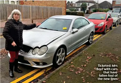  ?? ?? Ticketed: Mrs Boyt with cars that have fallen foul of the new lines