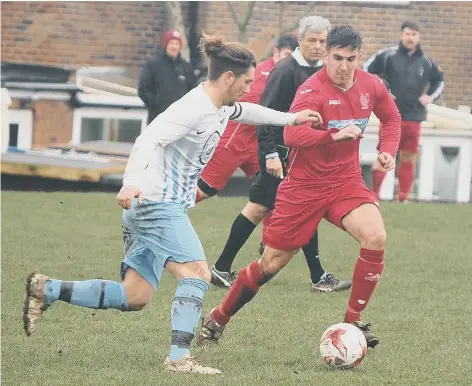  ??  ?? Itis Itis Rovers skipper Curtis Rose tries to find a way past Newlands’ Matthew Griffiths Pictures by Steve Lilly