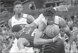  ?? Phelan M. Ebenhack Associated Press ?? WESLEY IWUNDU of Orlando is fouled by the Clippers’ Mike Scott after grabbing a rebound Friday. The Clippers have won 10 straight against the Magic.