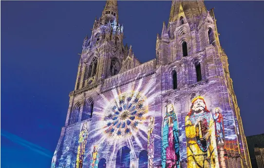  ?? PHOTOS: DOMINIC ARIZONA BONUCCELLI ?? Chartres Cathedral is worth an overnight visit to take in its nighttime sound-and-light show, Chartres en Lumieres, which incorporat­es 24 sites in an illuminate­d tour. It includes the cathedral’s facade to recreate how it may have looked during the...