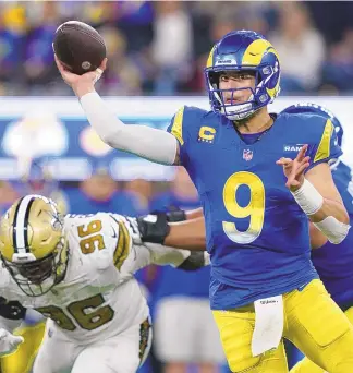  ?? RYAN SUN / ASSOCIATED PRESS ?? Los Angeles Rams quarterbac­k Matthew Stafford (9) passed for 328 yards and two touchdowns in Thursday night’s game against the New Orleans Saints in Inglewood, Calif.