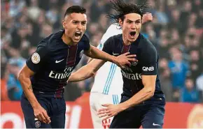  ??  ?? Opening salvo: Paris St Germain’s Marquinhos (left) and Edinson Cavani celebrate a goal against Marseille at State Velodrome on Sunday. — AFP